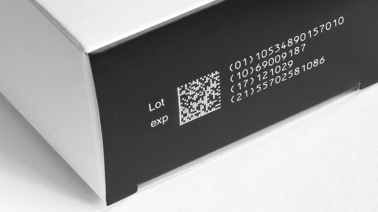 Videojet 3350 laser marking system performing lot number printing on packaged products.