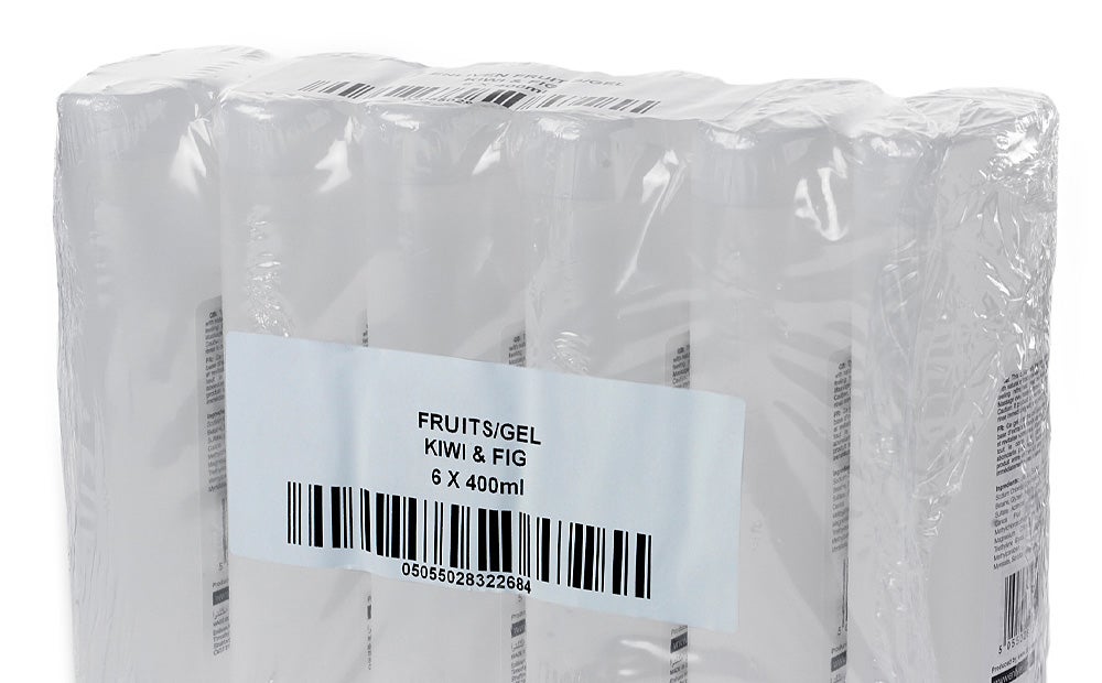 Videojet 9560 print and apply labeler applying barcode label to shrink-wrapped personal care products.
