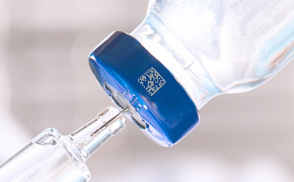 Laser marked 2D code on metal pharmaceutical vial cap for traceability