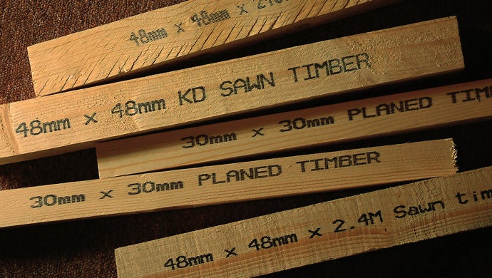 Printing on wood machine applying codes on timber and lumber