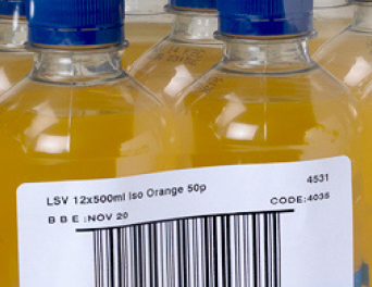 Illustration of shrink wrap label applied to a plastic bottle.