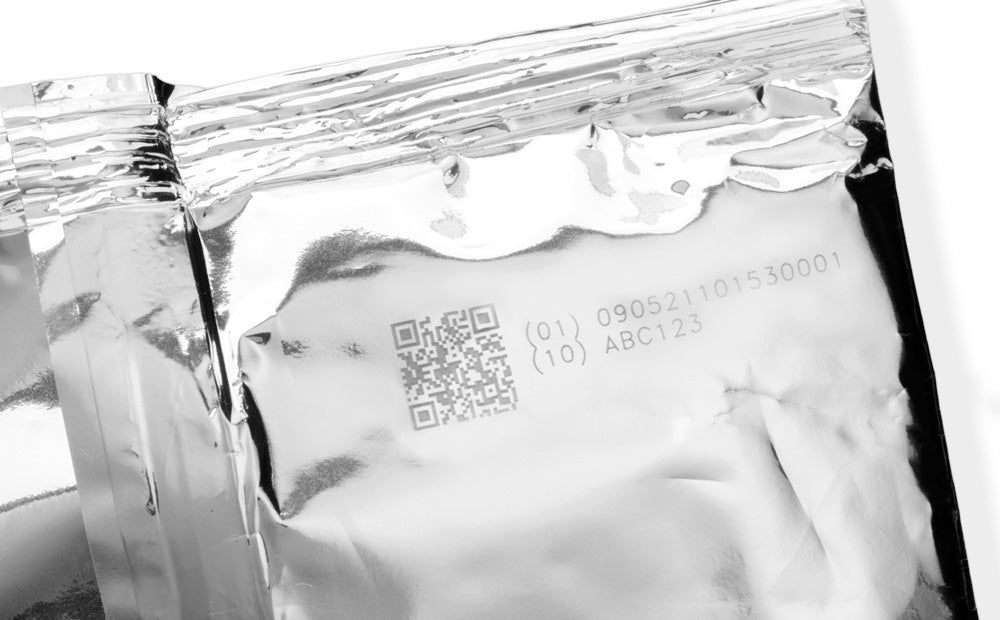 Laser-marked 2D code and lot information on flexible foil packaging for baked goods.