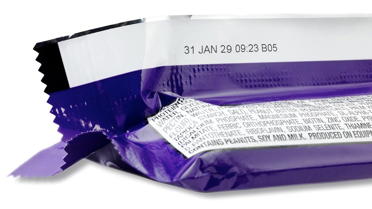 Snack package labeled by an expiry date printer
