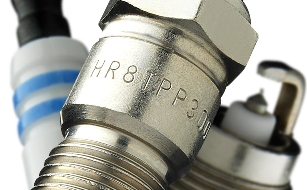 Laser marking on metal spark plug